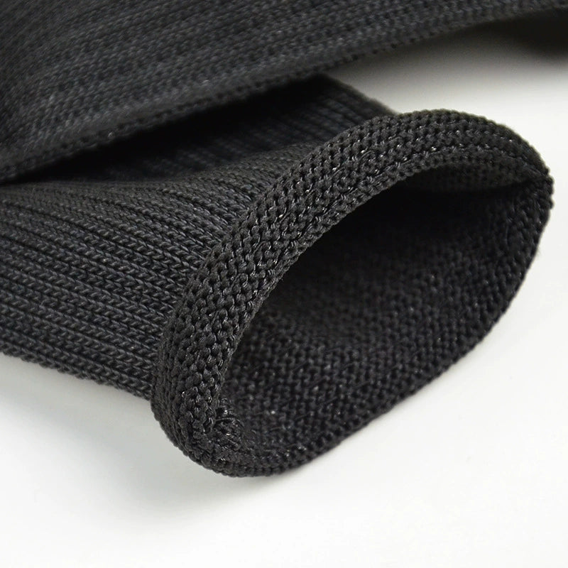 Close-up of black sleeve knitted texture and cuff, supplier appearance photograph